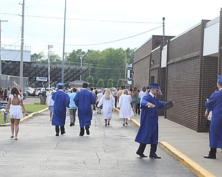 Graduates walk away for the last time after the Poland Seminary High School Graduation, Saturday, May 27, 2017 in Poland...(Nikos Frazier | The Vindicator)