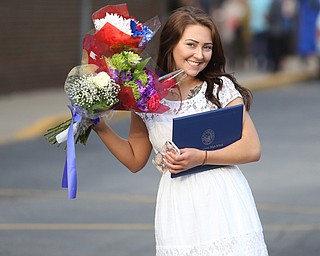Sierra Ryzner smiles with her flowers after the Poland Seminary High School Graduation, Saturday, May 27, 2017 in Poland...(Nikos Frazier | The Vindicator)