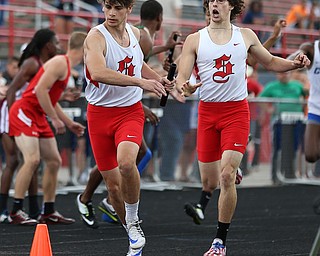 MICHAEL G TAYLOR | THE VINDICATOR- 05-27-16 - D2 Track & Field Regional at Austintown Fitch High School in Austintown, OH.In Boy's 4x400m relay, Salem's Connor McKee (right) hands off to his teammate Turner Johnson. Salem finished 2nd to qualify for state.
