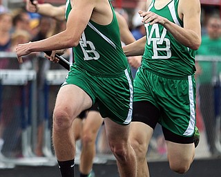 MICHAEL G TAYLOR | THE VINDICATOR- 05-27-16 - D2 Track & Field Regional at Austintown Fitch High School in Austintown, OH.In Boy's 4x400m relay, West Branch's Ethan Griffth (right) hands off to his teammate Carson Gossett. West Branch finished 4th to qualify for state.