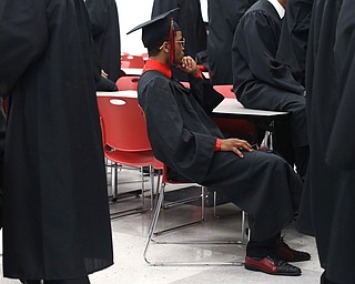 Kyle Barnes(center) waits before the Struthers High School Graduation, Sunday, May 28, 2017 in Struthers...(Nikos Frazier | The Vindicator)