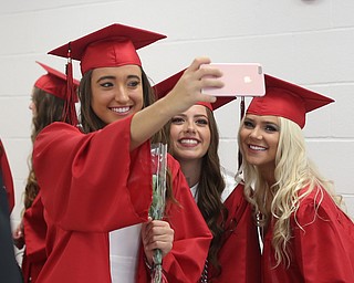 (from left) Torre Smrek, Karli Shives and Tylor Gordon take a selfie before the Struthers High School Graduation, Sunday, May 28, 2017 in Struthers...(Nikos Frazier | The Vindicator)