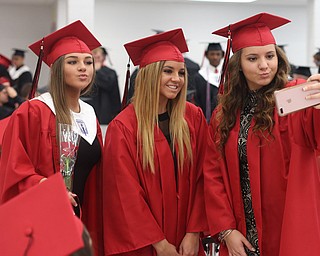 (from left) Peyton McLaughlin, Katie Schiffhauer and Gianna Gentile take a selfie before the Struthers High School Graduation, Sunday, May 28, 2017 in Struthers...(Nikos Frazier | The Vindicator)