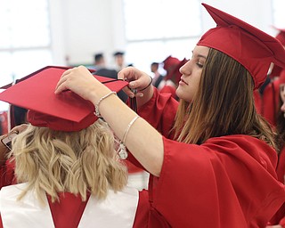 Marlo DeChellis adjusts the tassel on Jaime King's mortarboard before the Struthers High School Graduation, Sunday, May 28, 2017 in Struthers...(Nikos Frazier | The Vindicator)