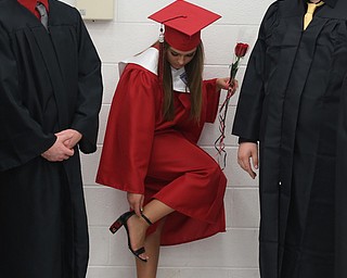 Gianna Gentile adjusts her heels before the Struthers High School Graduation, Sunday, May 28, 2017 in Struthers...(Nikos Frazier | The Vindicator)