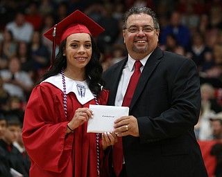 Davia Ford receives her diploma from board president Ron Shives during the Struthers High School Graduation, Sunday, May 28, 2017 in Struthers...(Nikos Frazier | The Vindicator)