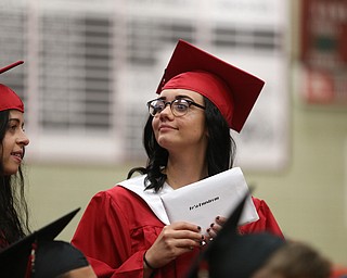 Te'a Engstrom looks around the field house after receiving her diploma from board president Ron Shives during the Struthers High School Graduation, Sunday, May 28, 2017 in Struthers...(Nikos Frazier | The Vindicator)