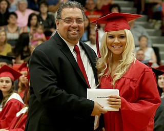 Taylor Gordon receives her diploma from board president Ron Shives during the Struthers High School Graduation, Sunday, May 28, 2017 in Struthers...(Nikos Frazier | The Vindicator)