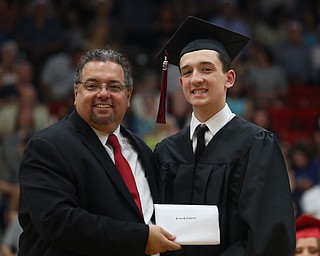 Derek Guzzo receives his diploma from board president Ron Shives during the Struthers High School Graduation, Sunday, May 28, 2017 in Struthers...(Nikos Frazier | The Vindicator)