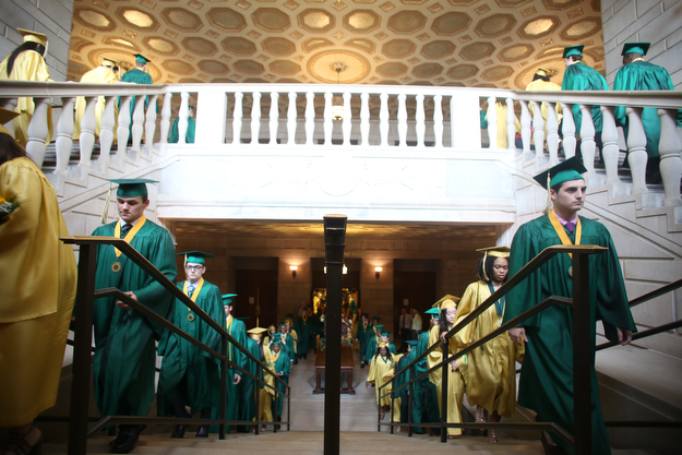 Students walk up the stairs before the Ursuline High School Graduation at Stambaugh Auditorium, Sunday, May 28, 2017 in Youngstown...(Nikos Frazier | The Vindicator)