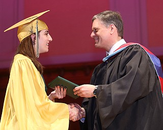 Paige Freisen receives her diploma from Principal Matthew Sammartino during the Ursuline High School Graduation at Stambaugh Auditorium, Sunday, May 28, 2017 in Youngstown...(Nikos Frazier | The Vindicator)