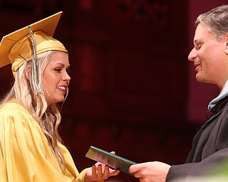 Alessandra Protopapa receives her diploma from Principal Matthew Sammartino during the Ursuline High School Graduation at Stambaugh Auditorium, Sunday, May 28, 2017 in Youngstown...(Nikos Frazier | The Vindicator)