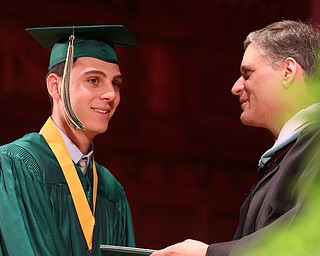 Vincent Venzeio receives his diploma from Principal Matthew Sammartino during the Ursuline High School Graduation at Stambaugh Auditorium, Sunday, May 28, 2017 in Youngstown...(Nikos Frazier | The Vindicator)