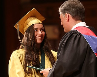 Yesenia Pezel receives her diploma from Principal Matthew Sammartino during the Ursuline High School Graduation at Stambaugh Auditorium, Sunday, May 28, 2017 in Youngstown...(Nikos Frazier | The Vindicator)
