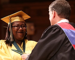Taysia Miller receives her diploma from Principal Matthew Sammartino during the Ursuline High School Graduation at Stambaugh Auditorium, Sunday, May 28, 2017 in Youngstown...(Nikos Frazier | The Vindicator)