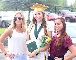 (from left) Sisters, Katie, Jennifer and Molly Woodford pose for photos after the Ursuline High School Graduation at Stambaugh Auditorium, Sunday, May 28, 2017 in Youngstown. The sisters are fourth generation Ursuline High School students...(Nikos Frazier | The Vindicator)