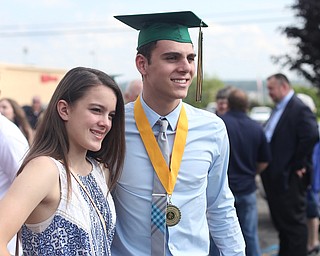 Vince Venzeio poses for a photo with his cousin Madison Massuri after the Ursuline High School Graduation at Stambaugh Auditorium, Sunday, May 28, 2017 in Youngstown...(Nikos Frazier | The Vindicator)