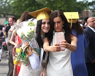 Moira Clancy(left) and sister, Caitlin take a selfie after the Ursuline High School Graduation at Stambaugh Auditorium, Sunday, May 28, 2017 in Youngstown...(Nikos Frazier | The Vindicator)