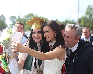 Moira Clancy(left), sister, Caitlin and dad, Steve take a selfie after the Ursuline High School Graduation at Stambaugh Auditorium, Sunday, May 28, 2017 in Youngstown...(Nikos Frazier | The Vindicator)