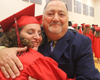 William D. Lewis The Vindicator Girard grad Jessica Shepherd gets a hug from assistant GHS principal William Christofil before 5-28-17 commencement at Girard HS.