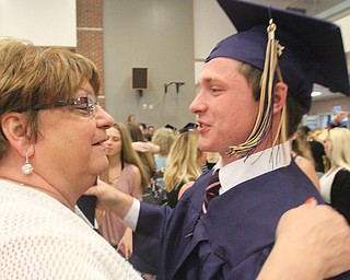William D. Lewis The Vindicator Lowellville grad Evan Stevens gets a hug from Joanne Coppola who was his tutor after 5-28-17 commencement at Lowellville HS.