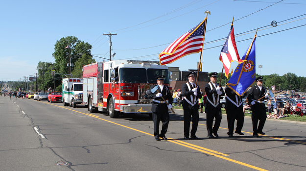 Members of the Boardman Firedepartment carried axes and and flags during the Memorial Day Parade in Boardman on Monday morning.   Dustin Livesay  |  The Vindicator  5/29/17  Boardman.