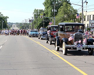 A row of classic cars drove up Market street and tossed out candy during the Memorial Day Parade in Boardman on Monday morning.   Dustin Livesay  |  The Vindicator  5/29/17  Boardman.