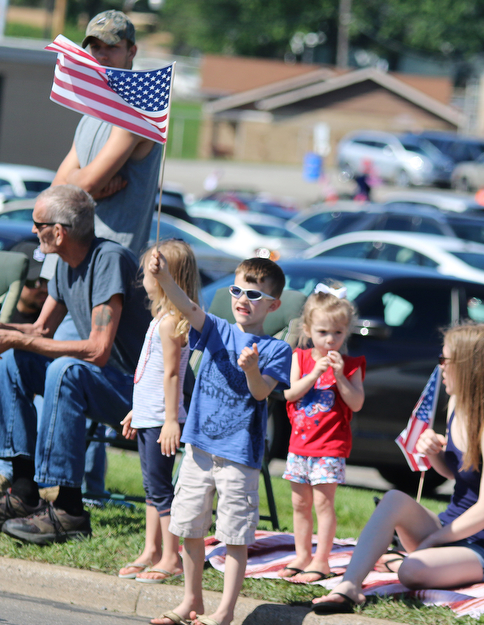TJ Wisener (6) of Boardman waves a flag during the Memorial Day Parade in Boardman on Monday morning.   Dustin Livesay  |  The Vindicator  5/29/17  Boardman.
