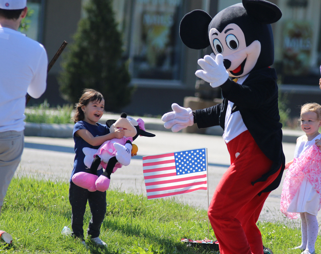 Isabella Zomida (4) of Struthers gets greeted by Mickey Mouse during the Memorial Day Parade in Boardman on Monday morning.   Dustin Livesay  |  The Vindicator  5/29/17  Boardman.