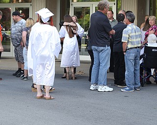 Families wait outside before the Howland High School Graduation at Packard Music Hall, Wednesday, May 31, 2017 in Warren...(Nikos Frazier | The Vindicator)