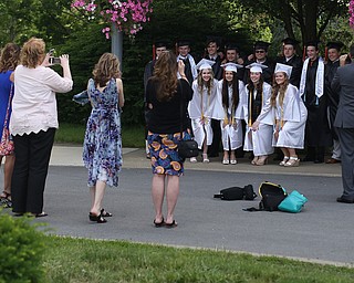 Parents take photos of the graduates before the Howland High School Graduation at Packard Music Hall, Wednesday, May 31, 2017 in Warren...(Nikos Frazier | The Vindicator)