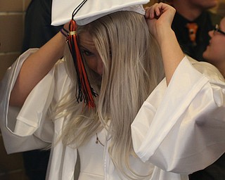 Haley Ohl adjusts her mortarboard before the Howland High School Graduation at Packard Music Hall, Wednesday, May 31, 2017 in Warren...(Nikos Frazier | The Vindicator)