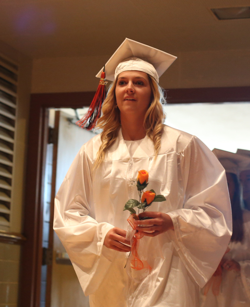 Sara Price walks in to the hall during the Howland High School Graduation at Packard Music Hall, Wednesday, May 31, 2017 in Warren...(Nikos Frazier | The Vindicator)