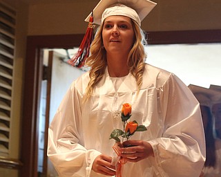 Sara Price walks in to the hall during the Howland High School Graduation at Packard Music Hall, Wednesday, May 31, 2017 in Warren...(Nikos Frazier | The Vindicator)