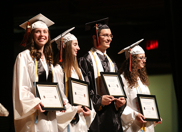 (from left) Valedictorians: Emily Schneider, Madeline Reuschling, Samuel Mattern and Amanda Koloskee stand on stage during the Howland High School Graduation at Packard Music Hall, Wednesday, May 31, 2017 in Warren...(Nikos Frazier | The Vindicator)
