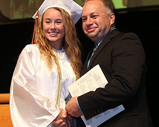 Isabella Albrecht shakes board member Matt Darrin's hand after receiving her diploma during the Howland High School Graduation at Packard Music Hall, Wednesday, May 31, 2017 in Warren...(Nikos Frazier | The Vindicator)