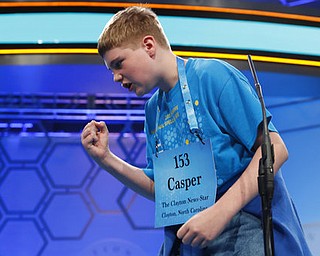 Casper Smith, 13, from Clayton, N.C., reacts after spelling his word incorrectly in the third round of the 90th Scripps National Spelling Bee, Wednesday, May 31, 2017, in Oxon Hill, Md. (AP Photo/Alex Brandon)