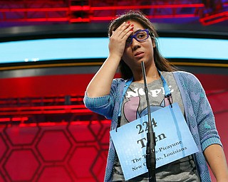 Tien Nguyen, 14, from New Orleans, La., reacts after spelling her word incorrectly in the third round of the 90th Scripps National Spelling Bee, Wednesday, May 31, 2017, in Oxon Hill, Md. (AP Photo/Alex Brandon)