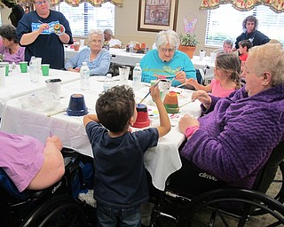 Neighbors | Alexis Bartolomucci.Residents from Beeghly Oaks painted flower pots during their Mother Nature Arbor Day celebration on April 28.