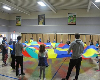 Neighbors | Alexis Bartolomucci.Students played different games with the parachute during DAWG Day on May 5 at Dobbins Elementary School.