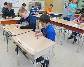 Neighbors | Alexis Bartolomucci.Cameron Wheaton and Ryan Nigh wrote positive messages on their rocks for the "Love Rocks" program station during DAWG Day at Dobbins Elementary.