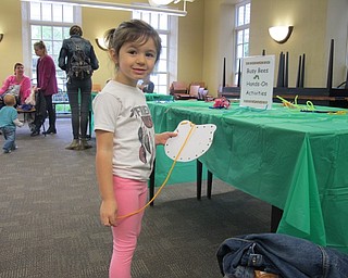 Neighbors | Alexis Bartolomucci.Bailey strung a piece of yarn through "A Very Hungry Caterpillar" character for the program at the Poland library on May 6.