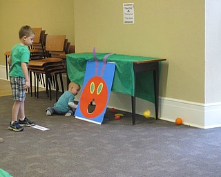 Neighbors | Alexis Bartolomucci.Children played the Feed the Caterpillar game at the Poland library for the "A Very Hungry Caterpillar" program.