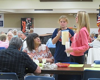 Neighbors | Alexis Bartolomucci.Austintown Fitch students spoke with guests as they served them drinks on May 11 during the Spring Senior Citizens Dinner at Austintown Fitch High School.