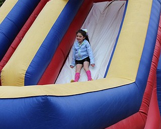 Neighbors | Abby Slanker.A Hilltop Elementary School third-grader slid down the inflatable bouncy slide during the school’s annual Student Appreciation Day on May 12.