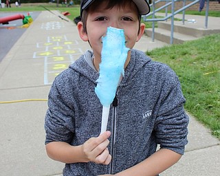 Neighbors | Abby Slanker.A Hilltop Elementary School third-grader had fun with his blue cotton candy during the school’s annual Student Appreciation Day on May 12.