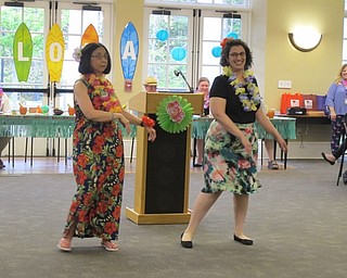 Neighbors | Alexis Bartolomucci.Mary Yee and Nicole DiPiero showed off their hula dancing moves on May 11 during the Murder in the Library: Hulas and Homicide program at the Poland library.