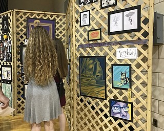 Neighbors | Alexis Bartolomucci.Boardman High School students looked at their classmates artwork during the Art Show on May 18.