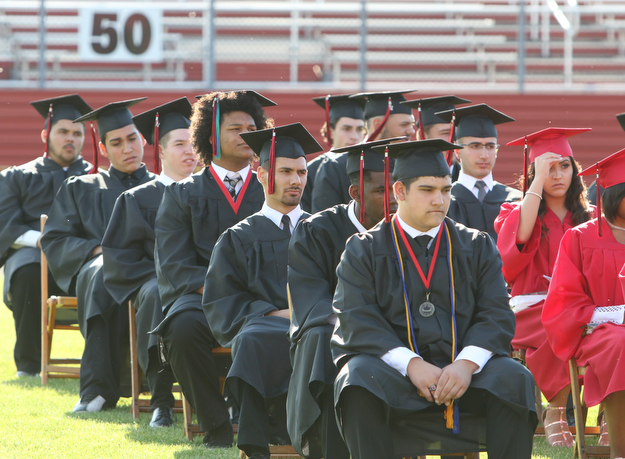        ROBERT K. YOSAY  | THE VINDICATOR...over 60 Graduates of Campbell High School received their diplomas at the John Knapic Stadium...Listening to Capt. William J Toti  Commencement speaker