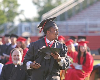        ROBERT K. YOSAY  | THE VINDICATOR...over 60 Graduates of Campbell High School received their diplomas at the John Knapic Stadium...Happy  Graduate as Estrella Gomez smiles and heads back after receiving his diploma